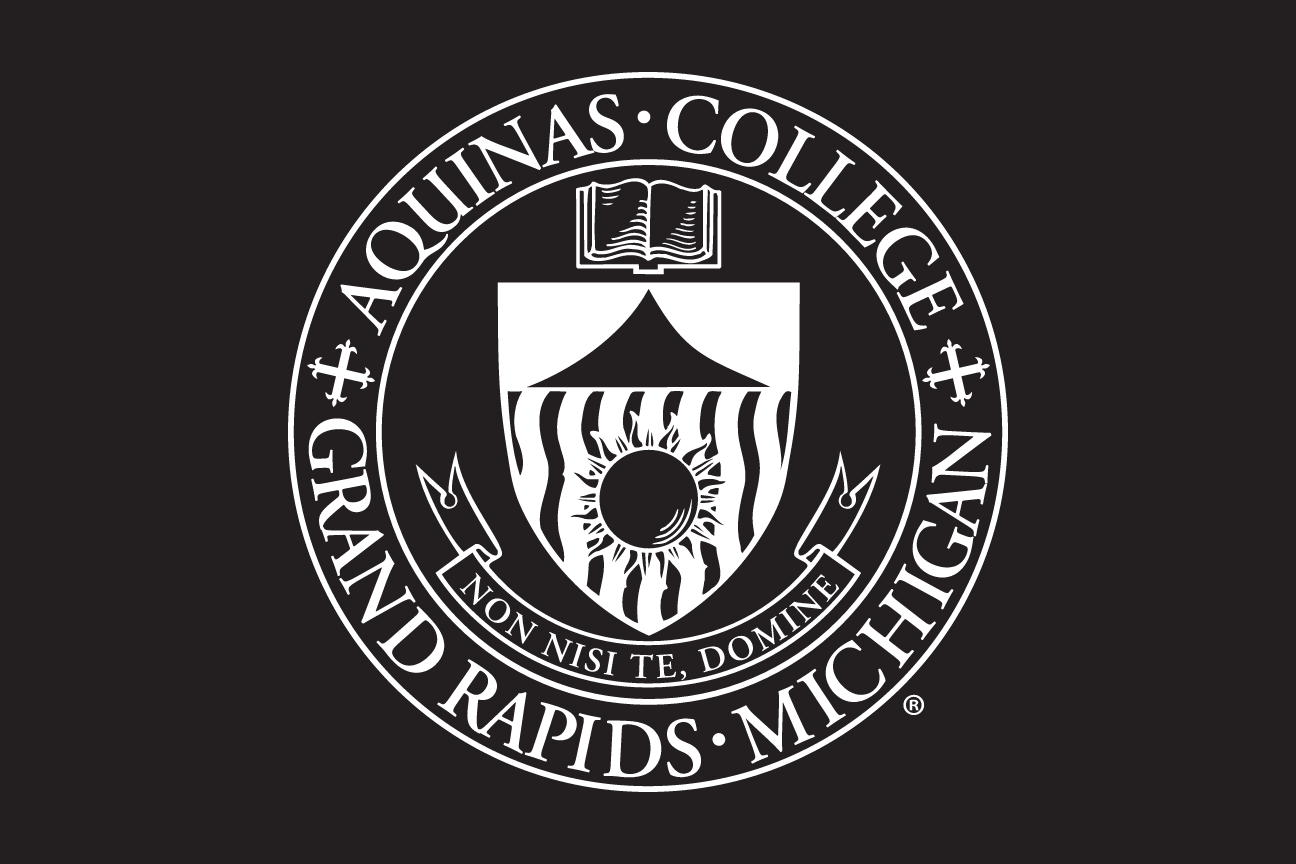 Aquinas College seal, white on black variant, cell 14