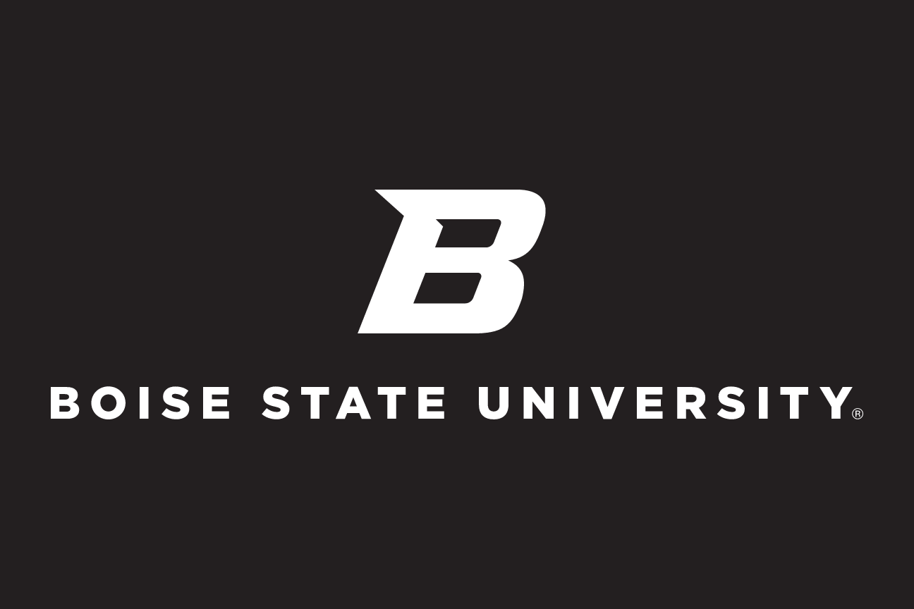 Primary Academic Mark, white one-color on black variant, cell 52