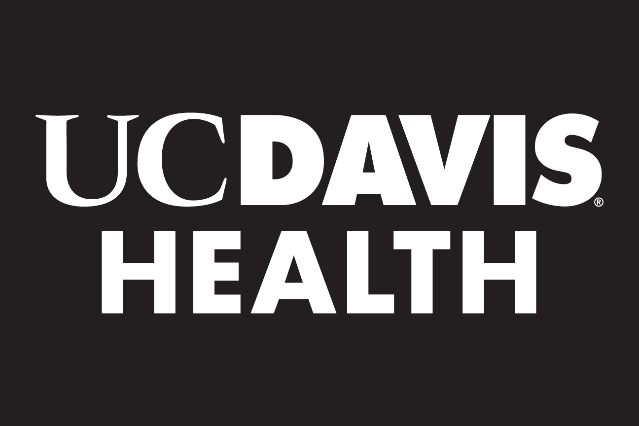 UC Davis Health wordmark, white/gold on black variant, cell 14