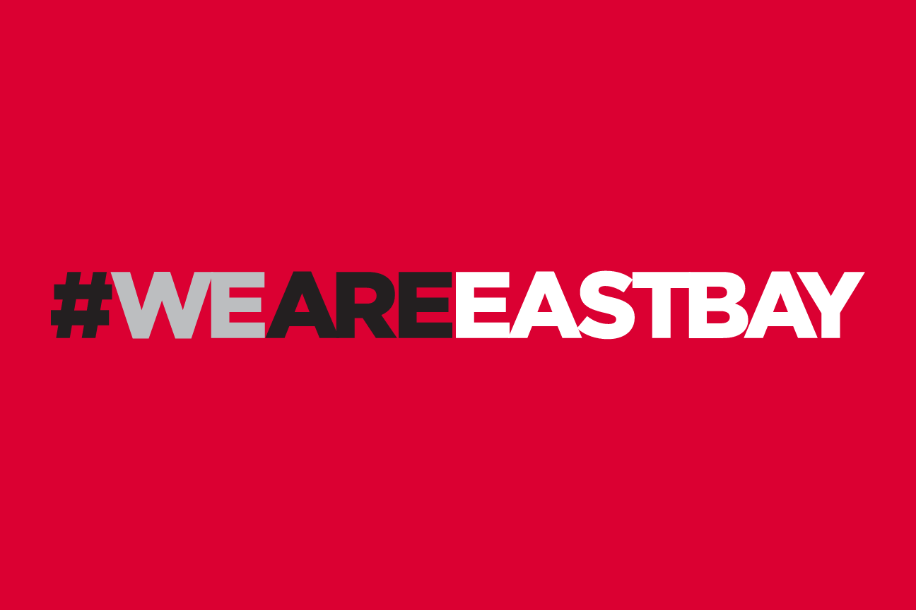 #WEAREEASTBAY wordmark, horizontal, white on red variant, cell 74