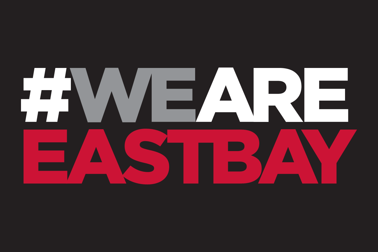 #WEARE EASTBAY wordmark, stacked 2 lines, white/red on black variant, cell 78