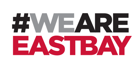 #WEARE EASTBAY wordmark, stacked 2 lines, black/red variant, cell 72