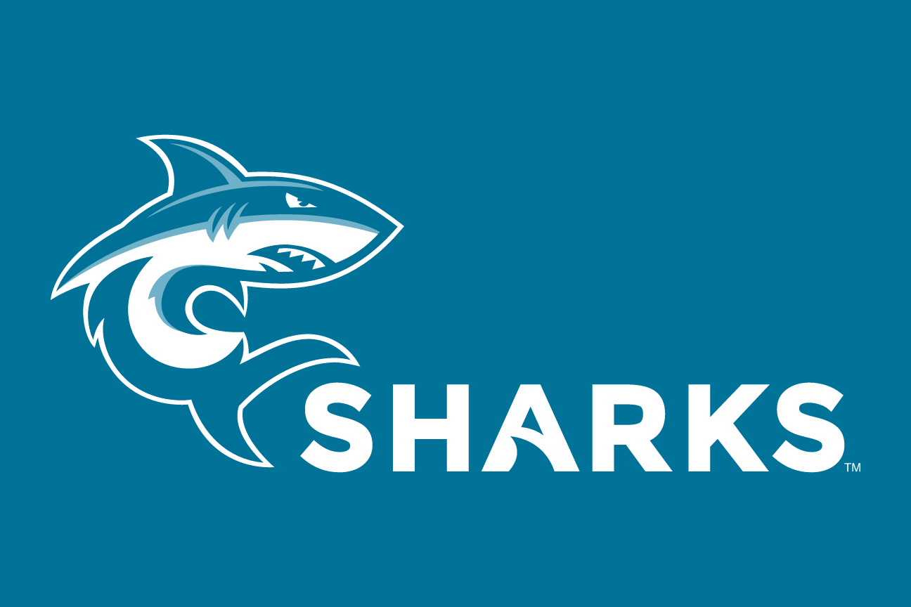 Shark mascot with SHARKS wordmark, reverse variant, cell 38