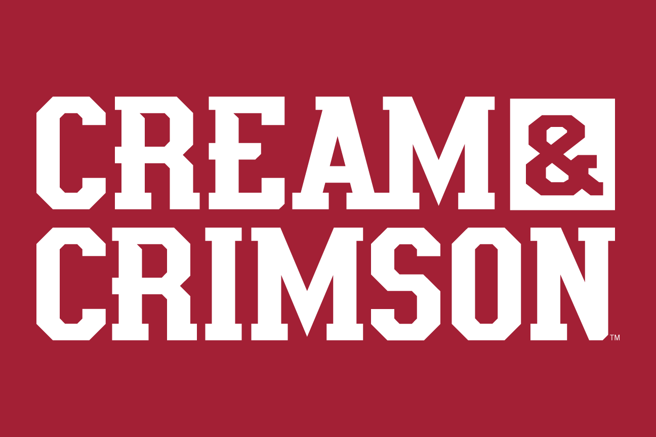 CREAM & CRIMSON wordmark, arched white outline on crimson variant, cell 42