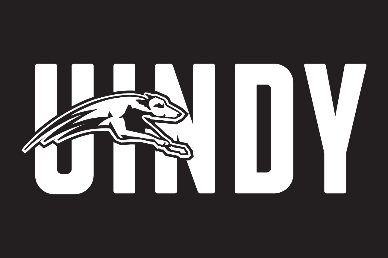 UINDY wordmark with greyhound, white on black variant, cell 12